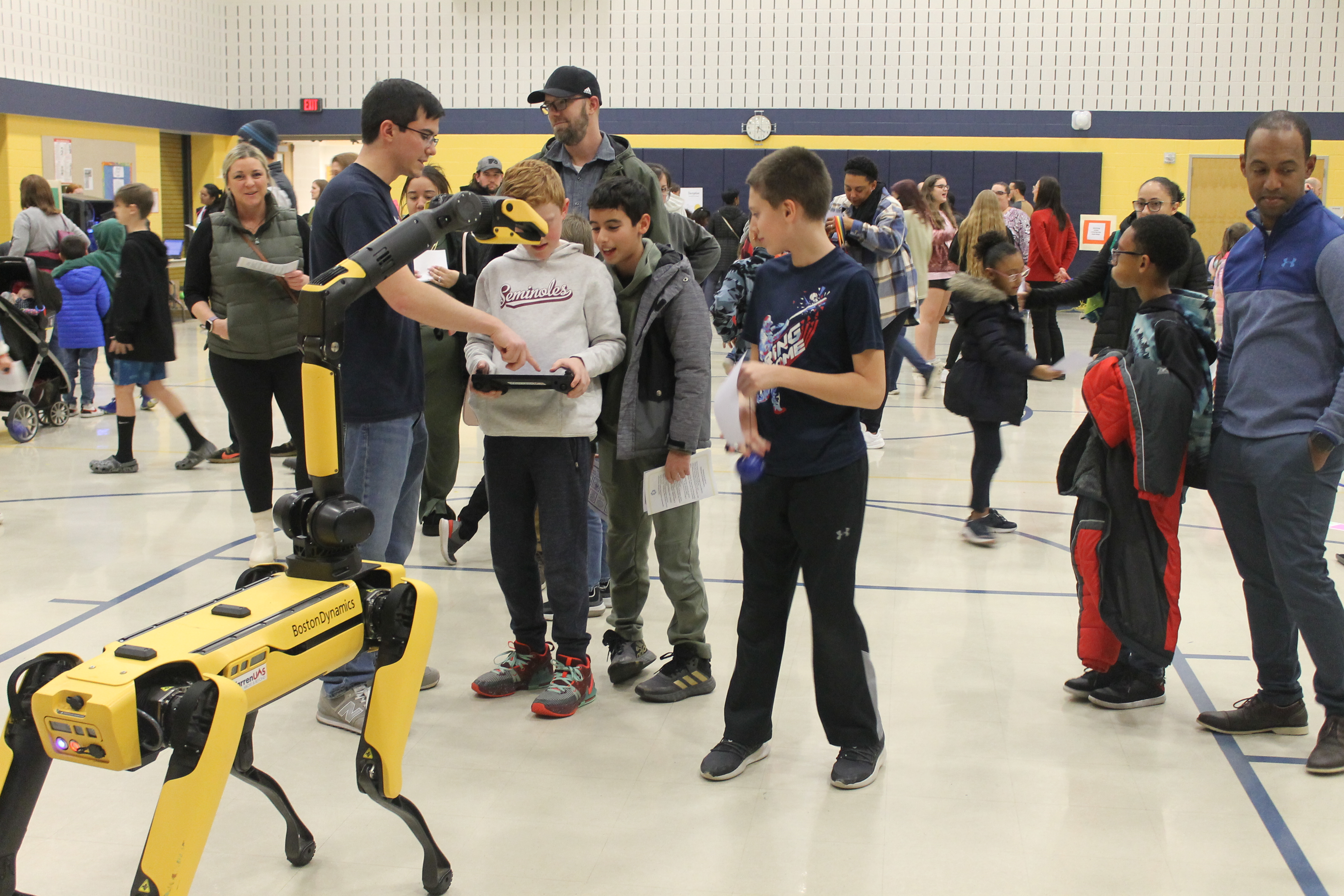Students working with Spot and his handle from Warren County CC.JPG
